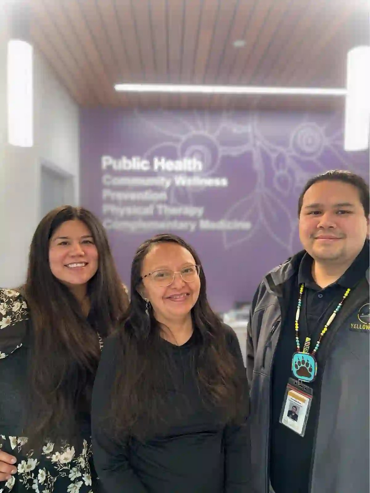 A group of Yellowhawk Public Health staff members standing together indoors